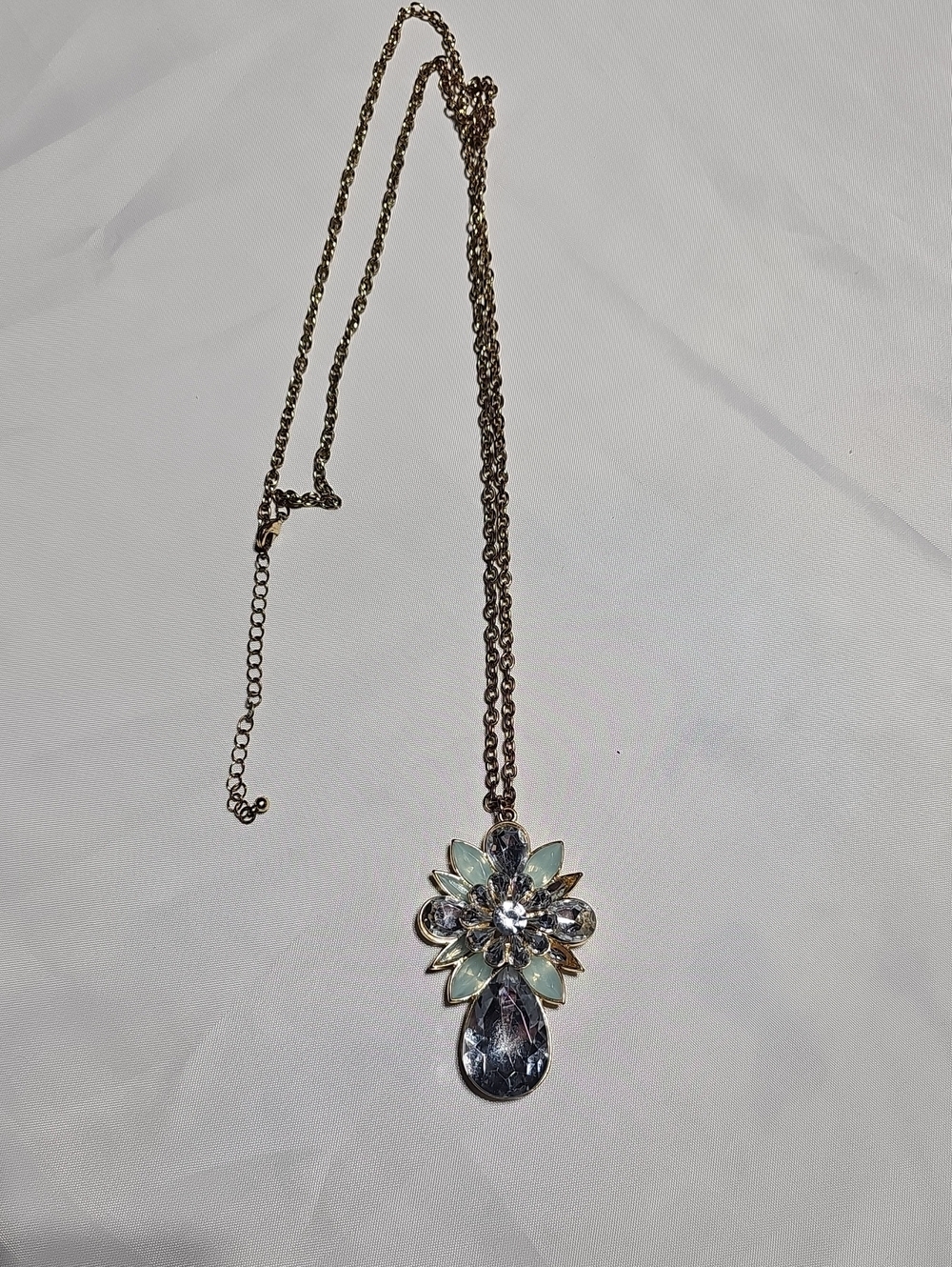 Crystal Flower Pendant Costume Necklace - Gold Chain with Light Blue Accents.